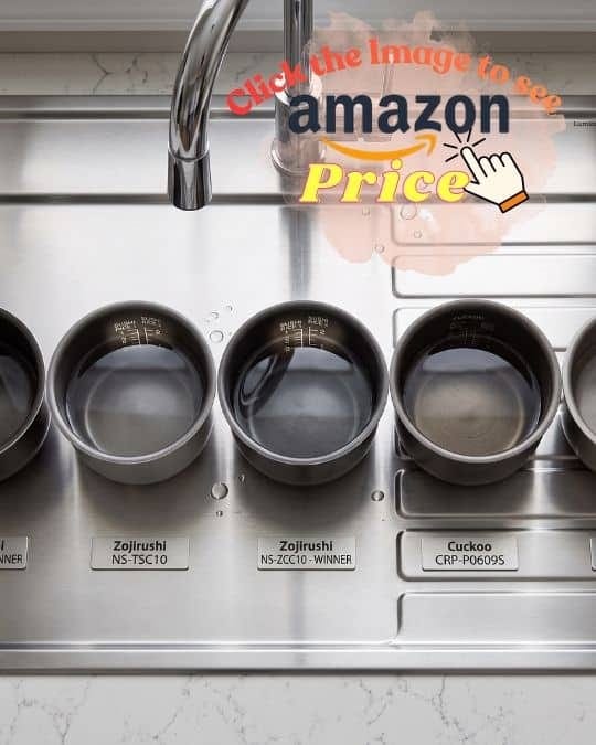 Inner Zojirushi, Cuckoo, and Tiger pans in a sink